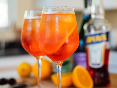 Elegant restaurant aperitif service with warm hospitality atmosphere