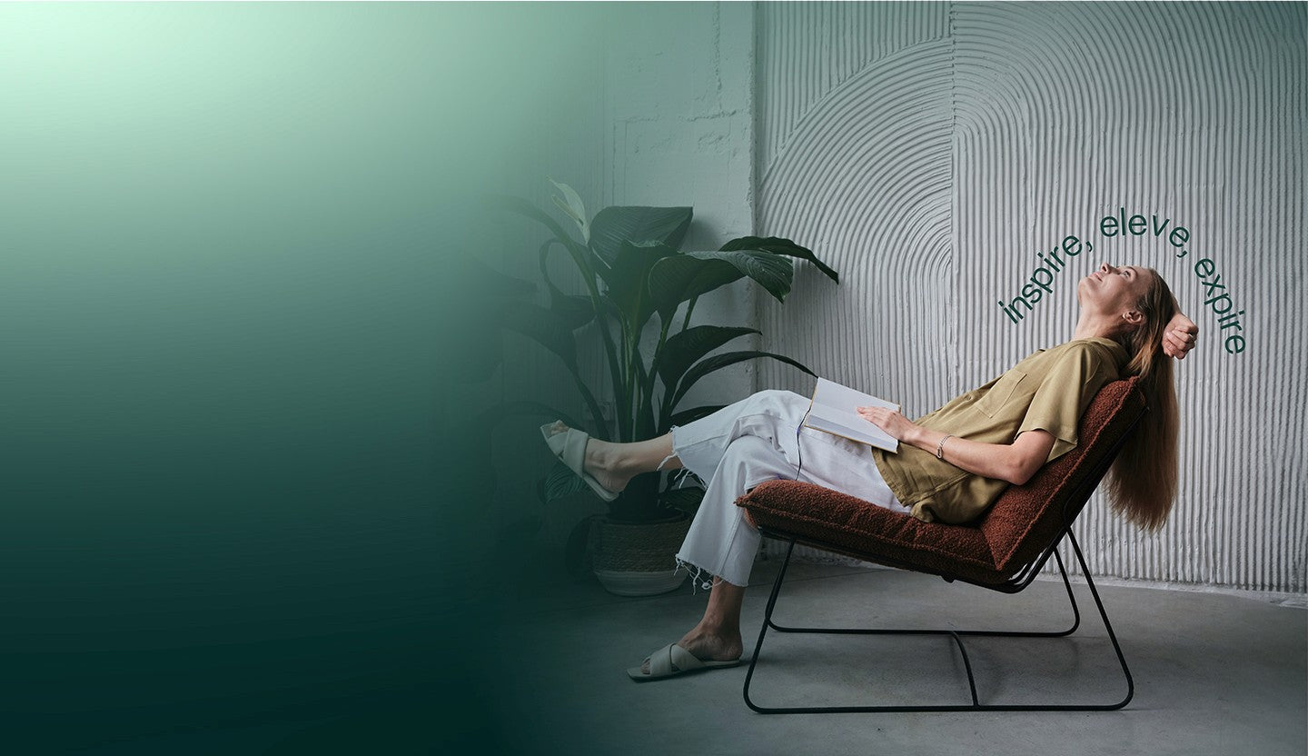 Woman relaxing in an Eleven scented space